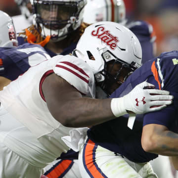 Auburn Tigers quarterback Payton Thorne is sacked by New Mexico State 