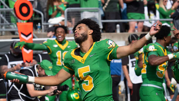 Oregon quarterback Dante Moore dances to the song “Shout” during a timeout at Autzen. 
