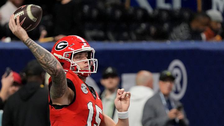 Georgia quarterback Carson Beck (15) warms up before the start of the SEC championship game against Texas in Atlanta, on Saturday, Dec. 7, 2024.