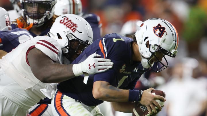 Auburn Tigers quarterback Payton Thorne is sacked by New Mexico State 