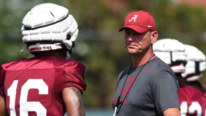 The Crimson Tide football team continued practice Thursday, Aug. 1, 2024, as they prepare for the season opener and the first game under new head coach Kalen DeBoer. DeBoer reaches out to give a low-five to Alabama defensive back Red Morgan (16).