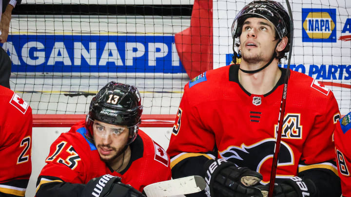 Mar 17, 2021; Calgary, Alberta, CAN; Calgary Flames left wing Johnny Gaudreau (13) and center Sean Monahan (23) on their bench against the Edmonton Oilers during the third period at Scotiabank Saddledome. Mandatory Credit: Sergei Belski-USA TODAY Sports