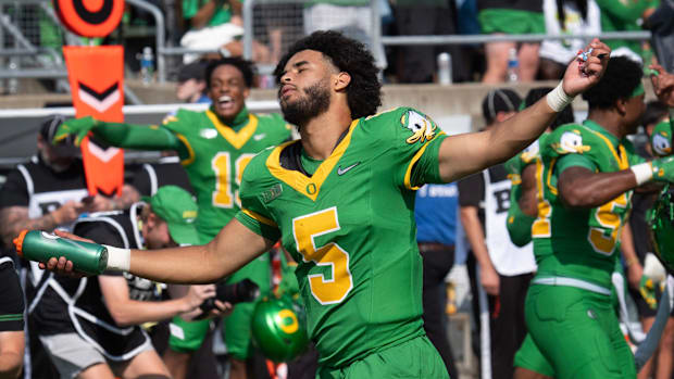 dan lanning oregon ducks northwestern wildcats oklahoma state cowboys dante moore quarterback running backs wide receiver