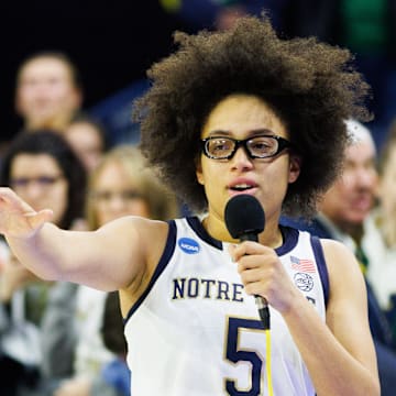Notre Dame guard Miles addresses the crowd after winning the second round of the NCAA Women's Basketball Tournament against Michigan at Purcell Pavilion.