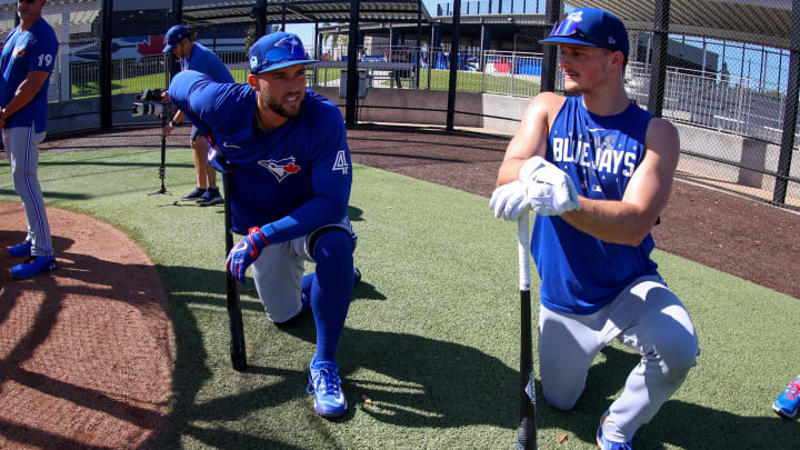 Feb 21, 2023; Dunedin, FL, USA;  Toronto Blue Jays center fielder George Springer (4) (left) and