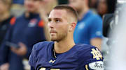 Sep 13, 2025; South Bend, Indiana, USA; Notre Dame Fighting Irish quarterback CJ Carr (13) looks on during the first half against the Texas A&M Aggies at Notre Dame Stadium. 
