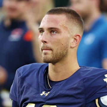 Sep 13, 2025; South Bend, Indiana, USA; Notre Dame Fighting Irish quarterback CJ Carr (13) looks on during the first half against the Texas A&M Aggies at Notre Dame Stadium. 