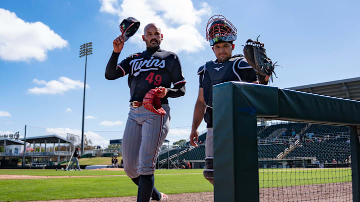 Pitcher Pablo Lopez, left, walks to the dugout after taking part in live batting practice during the Minnesota Twins first full-squad workout of spring training at Lee Health Sports Complex in Fort Myers, Fla., on Monday, Feb. 16, 2026.