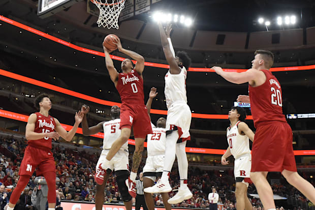 Rutgers Scarlet Knights center Myles Johnson (15) defends Nebraska Cornhuskers guard James Palmer Jr. (0).