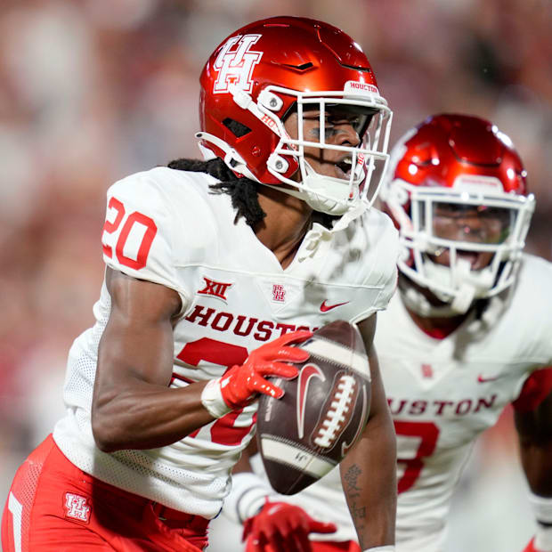 Houston Cougars defensive back Jeremiah Wilson (20) celebrates after an interception