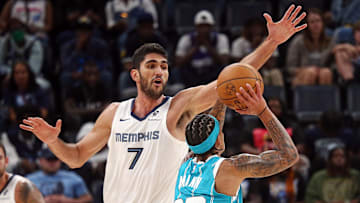 Oct 10, 2024; Memphis, Tennessee, USA; Memphis Grizzlies forward Santi Aldama (7) defends as Charlotte Hornets guard Tre Mann (23) shoots during the second half at FedExForum. Mandatory Credit: Petre Thomas-Imagn Images