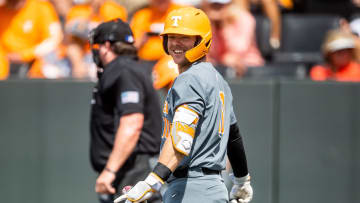Tennessee's Cal Stark (10) laughs after he nearly hit teammate Christian Moore with a foul ball during game two of the NCAA baseball tournament Knoxville Super Regional between Tennessee and Evansville held at Lindsey Nelson Stadium on Saturday, June 8, 2024.