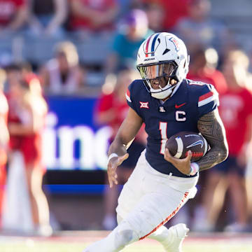Nov 8, 2025; Tucson, Arizona, USA; Arizona Wildcats quarterback Noah Fifita (1) against the Kansas Jayhawks in the second half at Arizona Stadium. Mandatory Credit: Mark J. Rebilas-Imagn Images