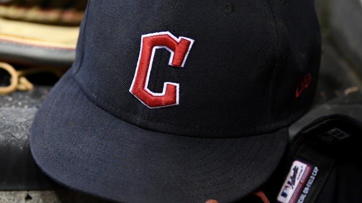 Aug 10, 2022; Detroit, Michigan, USA;  The gloves and hats of Cleveland Guardians players on the dugout steps between innings against the Detroit Tigers at Comerica Park.