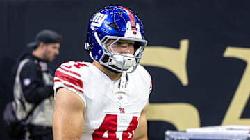 Oct 5, 2025; New Orleans, Louisiana, USA;  New York Giants running back Cam Skattebo (44) runs out the tunnel against New Orleans Saints during warmups at Caesars Superdome. Mandatory Credit: Stephen Lew-Imagn Images