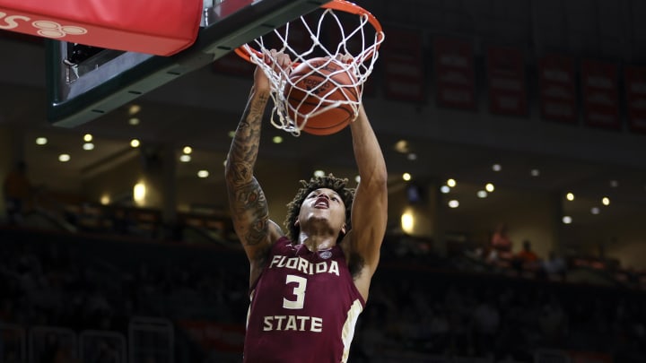 Jan 17, 2024; Coral Gables, Florida, USA; Florida State Seminoles forward Cam Corhen (3) dunks the basketball against the Miami Hurricanes during the first half at Watsco Center. Mandatory Credit: Sam Navarro-USA TODAY Sports