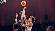 Illinois guard Keaton Wagler (23) launches a floater over Texas Tech's Christian Anderson in the Illini's 81-77 win over the Red Raiders last week at the State Farm Center in Champaign, Illinois.