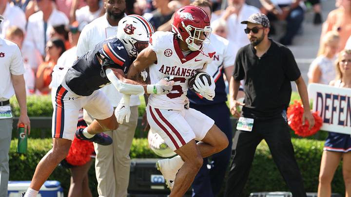 Sep 21, 2024; Auburn, Alabama, USA;  Auburn Tigers safety Jerrin Thompson (1) tackles Arkansas Razorbacks wide receiver Isaiah Sategna (6) during the first quarter at Jordan-Hare Stadium. Mandatory Credit: John Reed-Imagn Images