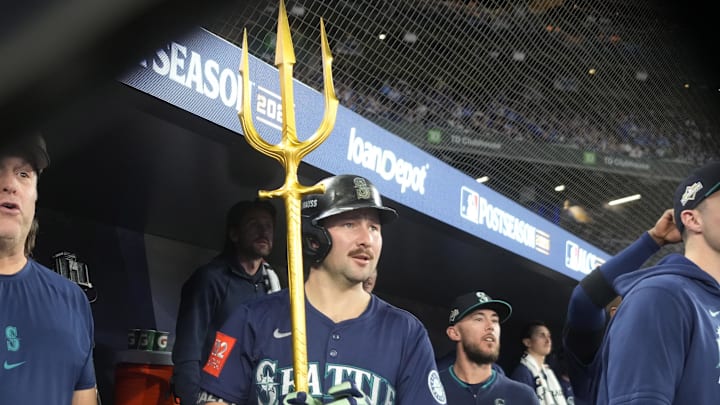 Oct 20, 2025; Toronto, Ontario, CAN; Seattle Mariners catcher Cal Raleigh (29) celebrates in the dugout after scoring against the Toronto Blue Jays in the fifth inning during game seven of the ALCS round for the 2025 MLB playoffs at Rogers Centre. Mandatory Credit: John E. Sokolowski-Imagn Images Oct 20, 2025; Toronto, Ontario, CAN; Seattle Mariners catcher Cal Raleigh (29) celebrates in the dugout after scoring against the Toronto Blue Jays in the fifth inning during game seven of the ALCS round for the 2025 MLB playoffs at Rogers Centre. Mandatory Credit: John E. Sokolowski-Imagn Images