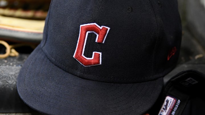 Aug 10, 2022; Detroit, Michigan, USA;  The gloves and hats of Cleveland Guardians players on the dugout steps between innings against the Detroit Tigers at Comerica Park.