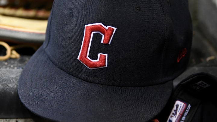 Aug 10, 2022; Detroit, Michigan, USA;  The gloves and hats of Cleveland Guardians players on the dugout steps between innings against the Detroit Tigers at Comerica Park.