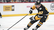 Feb 4, 2025; Pittsburgh, Pennsylvania, USA;  Pittsburgh Penguins center Sidney Crosby (87) handles the puck against the New Jersey Devils during the third period at PPG Paints Arena. Mandatory Credit: Charles LeClaire-Imagn Images