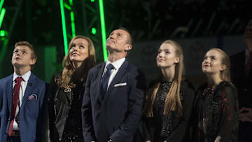 Nov 24, 2017; Dallas, TX, USA; Former Dallas Stars right winger Jere Lehtinen watches with his son Joel Lehtinen and wife Jaana Lehtinen and daughters Sofia Lehtinen  and Anna Lehtinen as his number 26 is retired before the game against the Calgary Flames at the American Airlines Center. Mandatory Credit: Jerome Miron-Imagn Images