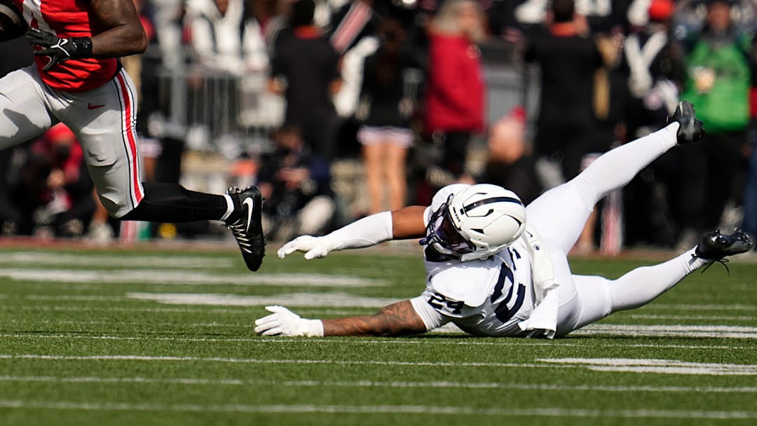 Ohio State Buckeyes wide receiver Jeremiah Smith (4) runs past Penn State Nittany Lions linebacker Amare Campbell (24) Ohio State Buckeyes wide receiver Jeremiah Smith (4) runs past Penn State Nittany Lions linebacker Amare Campbell (24)