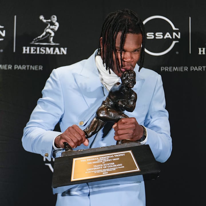 Colorado Buffaloes wide receiver/cornerback Travis Hunter poses for a photo after winning the Heisman Trophy award 
