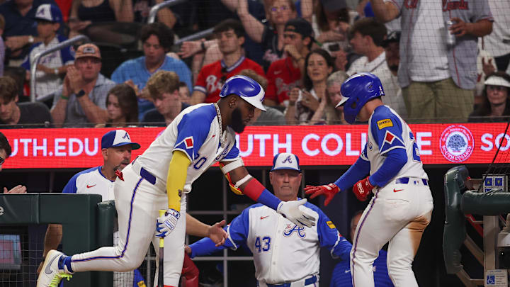 Apr 19, 2025; Atlanta, Georgia, USA; Atlanta Braves shortstop Nick Allen (2) celebrates after scoring with designated hitter Marcell Ozuna (20) and manager Brian Snitker (43) against the Minnesota Twins in the sixth inning at Truist Park. Mandatory Credit: Brett Davis-Imagn Images
