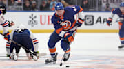Mar 14, 2025; Elmont, New York, USA; New York Islanders center Jean-Gabriel Pageau (44) skates with the puck against the Edmonton Oilers during overtime at UBS Arena. Mandatory Credit: Thomas Salus-Imagn Images