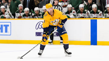Jan 18, 2025; Nashville, Tennessee, USA;  Nashville Predators center Steven Stamkos (91) skates with the puck against the Minnesota Wild during the first period at Bridgestone Arena. Mandatory Credit: Steve Roberts-Imagn Images
