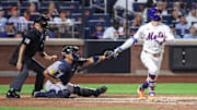 New York Mets left fielder Brandon Nimmo hits a three-run home run in the fourth inning against the Atlanta Braves at Citi Field.