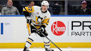 Dec 28, 2024; Elmont, New York, USA; Pittsburgh Penguins center Sidney Crosby (87) controls the puck against the New York Islanders during the first period at UBS Arena. Mandatory Credit: Brad Penner-Imagn Images