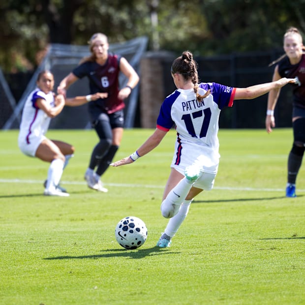 TCU 's Cam Patton kicks the ball during the match over Iowa State