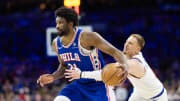 May 2, 2024; Philadelphia, Pennsylvania, USA; Philadelphia 76ers center Joel Embiid (21) drives against New York Knicks guard Donte DiVincenzo (0) during the second half of game six of the first round for the 2024 NBA playoffs at Wells Fargo Center. Mandatory Credit: Bill Streicher-USA TODAY Sports