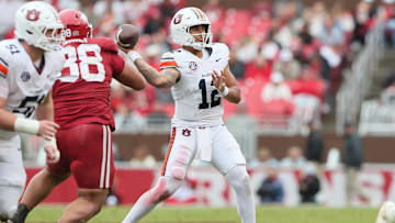 Oct 25, 2025; Fayetteville, Arkansas, USA; Auburn Tigers quarterback Ashton Daniels (12) passes during the fourth quarter against the Arkansas Razorbacks at Donald W. Reynolds Razorback Stadium. Mandatory Credit: Nelson Chenault-Imagn Images