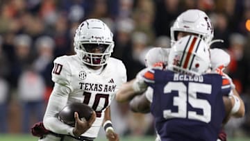 Nov 23, 2024; Auburn, Alabama, USA;  Texas A&M Aggies quarterback Marcel Reed (10) carries against the Auburn Tigers during the first quarter at Jordan-Hare Stadium. Mandatory Credit: John Reed-Imagn Images