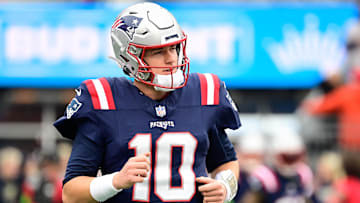 Dec 17, 2023; Foxborough, Massachusetts, USA; New England Patriots quarterback Mac Jones (10) warms up before a game against the Kansas City Chiefs at Gillette Stadium. Mandatory Credit: Eric Canha-Imagn Images
