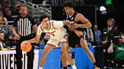 Mar 21, 2025; Milwaukee, WI, USA: Illinois Fighting Illini forward Will Riley (7) drives to the hoop past Xavier Musketeers guard Marcus Foster (1) during the first half at Fiserv Forum. Mandatory Credit: Benny Sieu-Imagn Images