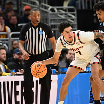 Mar 21, 2025; Milwaukee, WI, USA: Illinois Fighting Illini forward Will Riley (7) drives to the hoop past Xavier Musketeers guard Marcus Foster (1) during the first half at Fiserv Forum. Mandatory Credit: Benny Sieu-Imagn Images