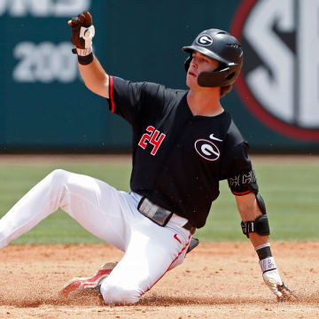 Georgia's Charlie Condon (24) slides into second base during a NCAA Athens Regional baseball game against Army in Athens, Ga., on Friday, May 31, 2024. Georgia won 8-7.