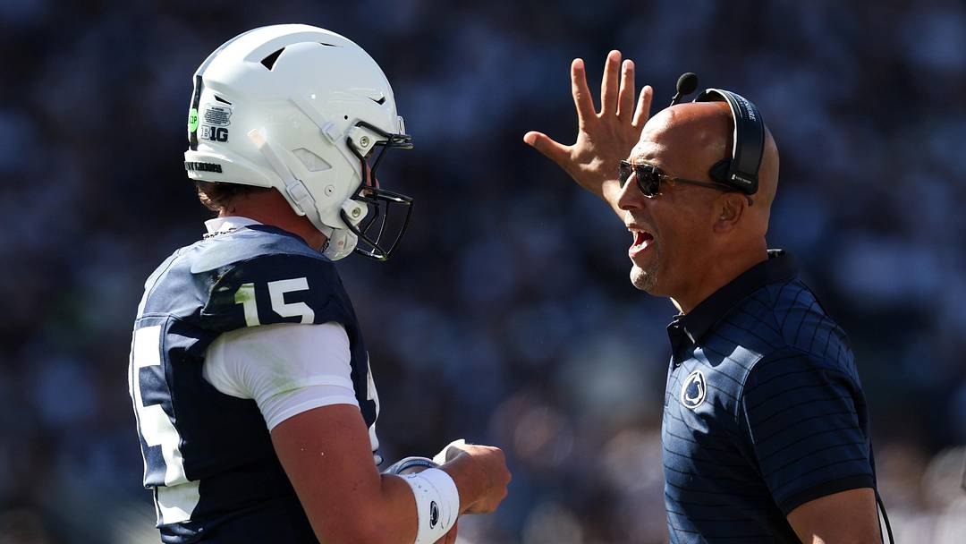 Penn State Nittany Lions head coach James Franklin talks with quarterback Drew Allar (15) 