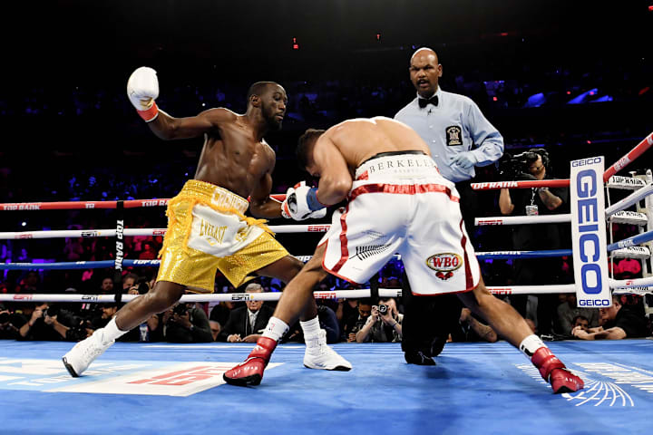 Terence Crawford trades punches with Amir Khan during the WBO welterweight title fight at Madison Square Garden. 