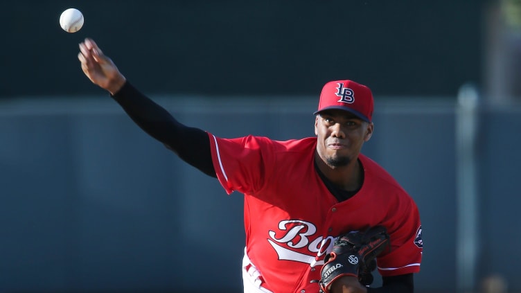 Louisville Bats' Hunter Greene (3) delivers a pitch.