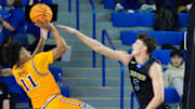 Drexel's Jason Drake shoots against the defense of Delaware's Macon Emory (5) in the second half of Delaware's 78-74 loss at the Bob Carpenter Center, Thursday, Feb. 20, 2025.
