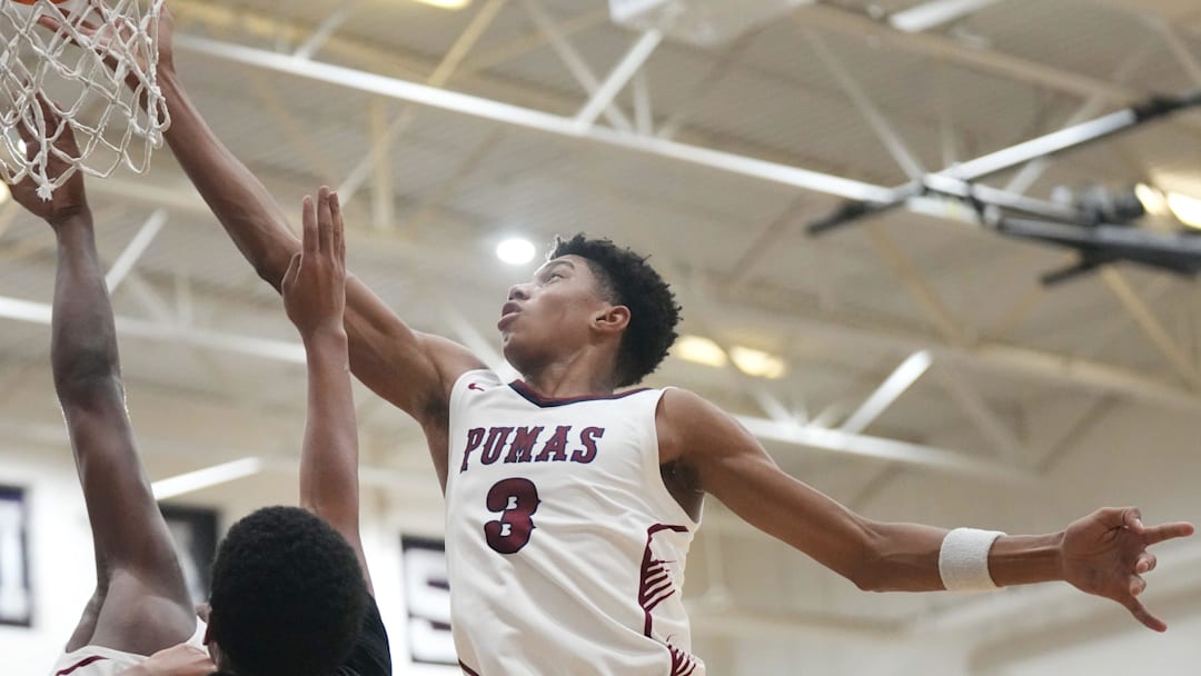 Perry Pumas forward Bruce Branch III (3) shoots the ball over Hamilton Huskies guard Davion Harris (2) at Perry High School in Gilbert on Dec. 18, 2024. Perry Pumas forward Bruce Branch III (3) shoots the ball over Hamilton Huskies guard Davion Harris (2) at Perry High School in Gilbert on Dec. 18, 2024.