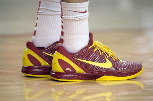 Kobe Bryant's red and gold Nike sneakers.