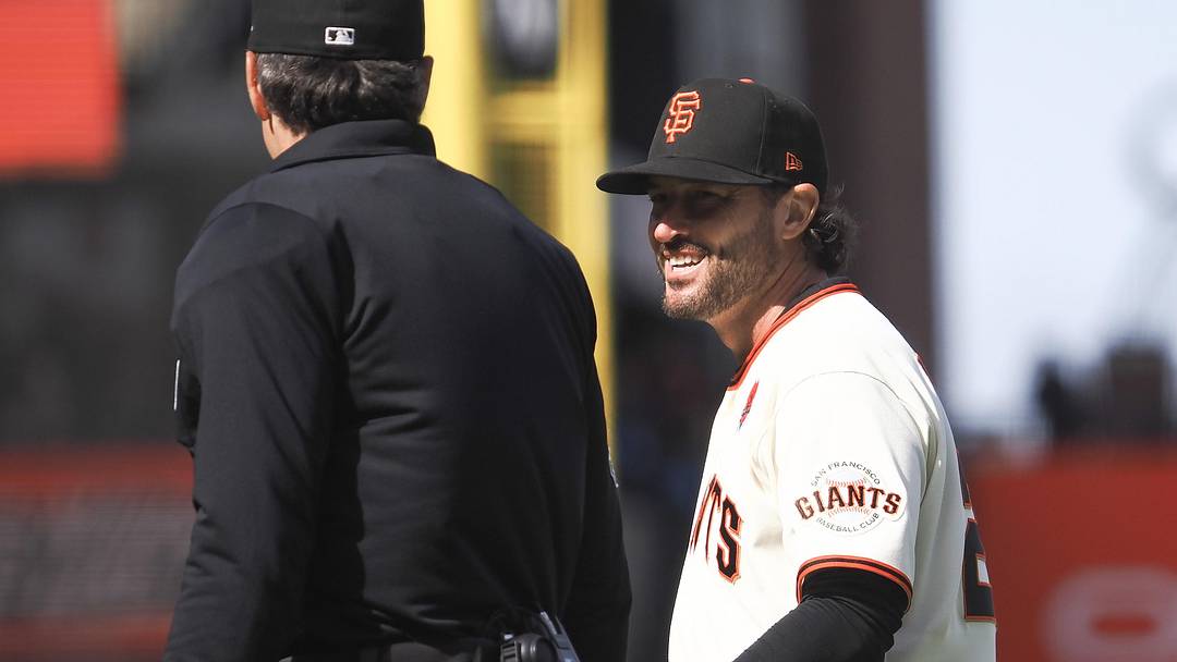 May 25, 2026; San Francisco, California, USA; San Francisco Giants manager Tony Vitello (23) smiles with the umpire during the ninth inning against the Arizona Diamondbacks at Oracle Park. Mandatory Credit: Kelley L Cox-Imagn Images