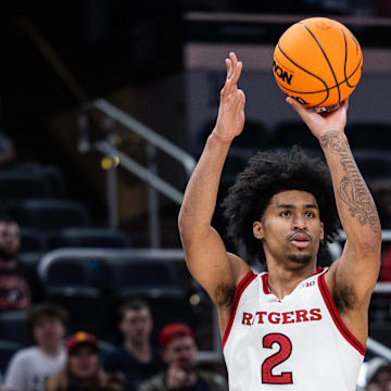 Mar 12, 2025; Indianapolis, IN, USA; Rutgers Scarlet Knights guard Dylan Harper (2) shoots the ball while USC Trojans guard Desmond Claude (1) defends in the second half at Gainbridge Fieldhouse. Mandatory Credit: Trevor Ruszkowski-Imagn Images
